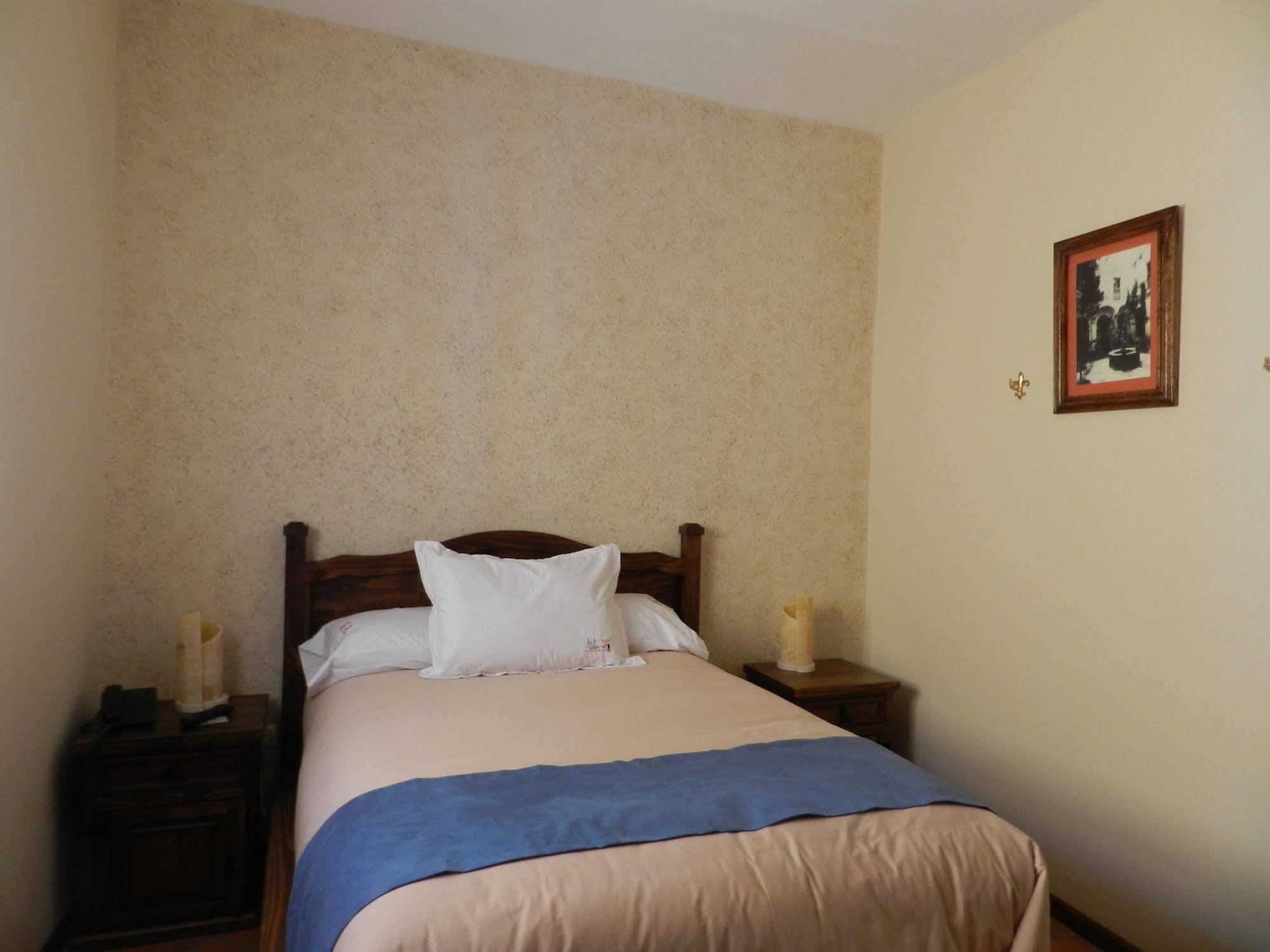 Collection O Al Otro Lado Del Rio, Puebla 호텔 외부 사진 A bedroom at the hotel